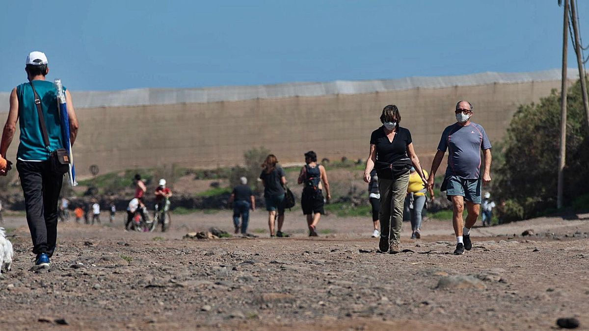 Laguneros and visitors walk the Blue Trail of Punta del Hidalgo.