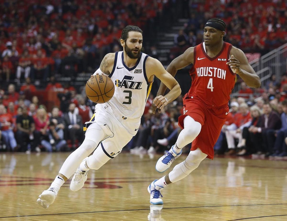 HOUSTON, TEXAS - APRIL 14: Ricky Rubio #3 of the Utah Jazz drives around Danuel House Jr. #4 of the Houston Rockets in the first quarter during Game One of the first round of the 2019 NBA Western Conference Playoffs between the Houston Rockets and the Utah Jazz at Toyota Center on April 14, 2019 in Houston, Texas. NOTE TO USER: User expressly acknowledges and agrees that, by downloading and or using this photograph, User is consenting to the terms and conditions of the Getty Images License Agreement.   Bob Levey/Getty Images/AFP