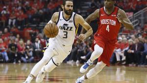 HOUSTON, TEXAS - APRIL 14: Ricky Rubio #3 of the Utah Jazz drives around Danuel House Jr. #4 of the Houston Rockets in the first quarter during Game One of the first round of the 2019 NBA Western Conference Playoffs between the Houston Rockets and the Utah Jazz at Toyota Center on April 14, 2019 in Houston, Texas. NOTE TO USER: User expressly acknowledges and agrees that, by downloading and or using this photograph, User is consenting to the terms and conditions of the Getty Images License Agreement.   Bob Levey/Getty Images/AFP