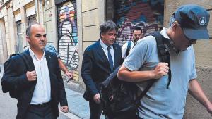 Turull y Puigdemont, el jueves vamino del estrado desde donde el expresident pronunció su alocución.