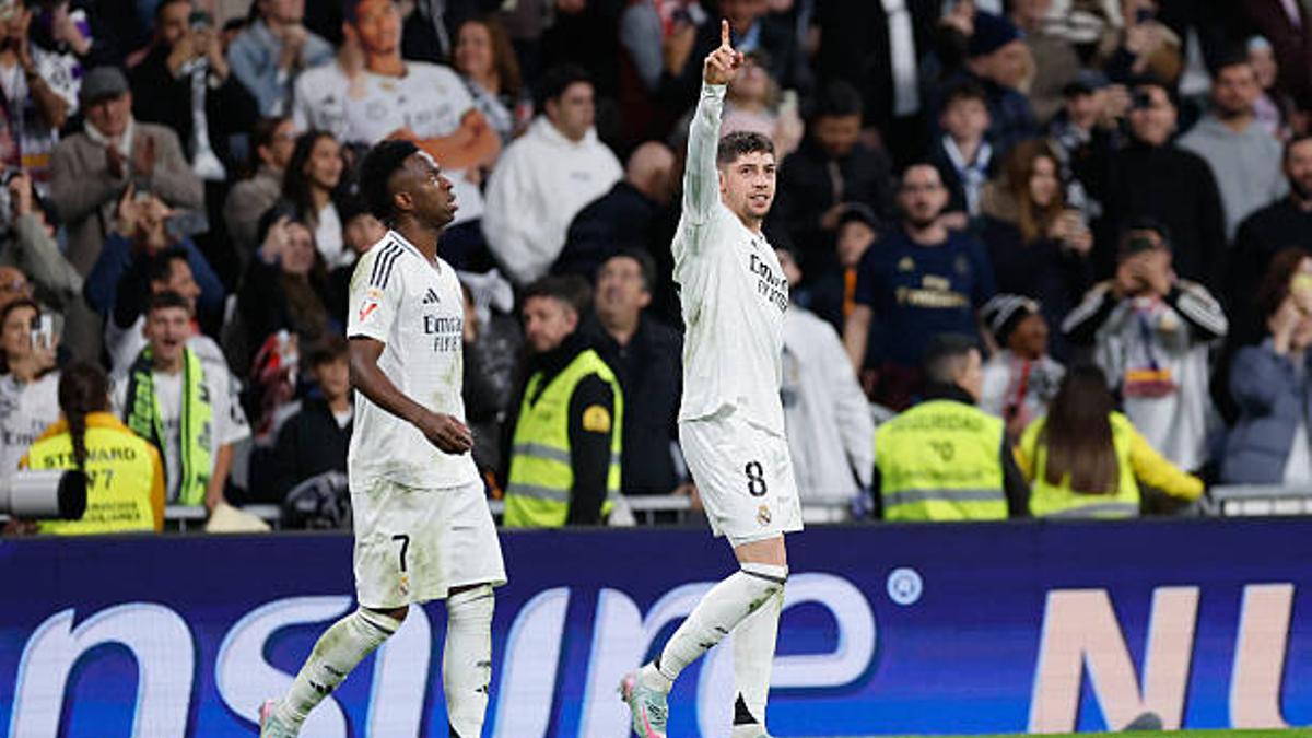 Real Madrid's Uruguayan midfielder #08 Federico Valverde (R) celebrates scoring their first goal during the Spanish league football match between Real Madrid CF and Athletic Club Bilbao at the Santiago Bernabeu Stadium in Madrid, on April 20, 2025. (Photo by OSCAR DEL POZO / AFP) (Photo by OSCAR DEL POZO/AFP via Getty Images)