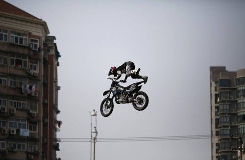 A competitor performs in the FMX Course competition during the World Extreme Games in Shanghai