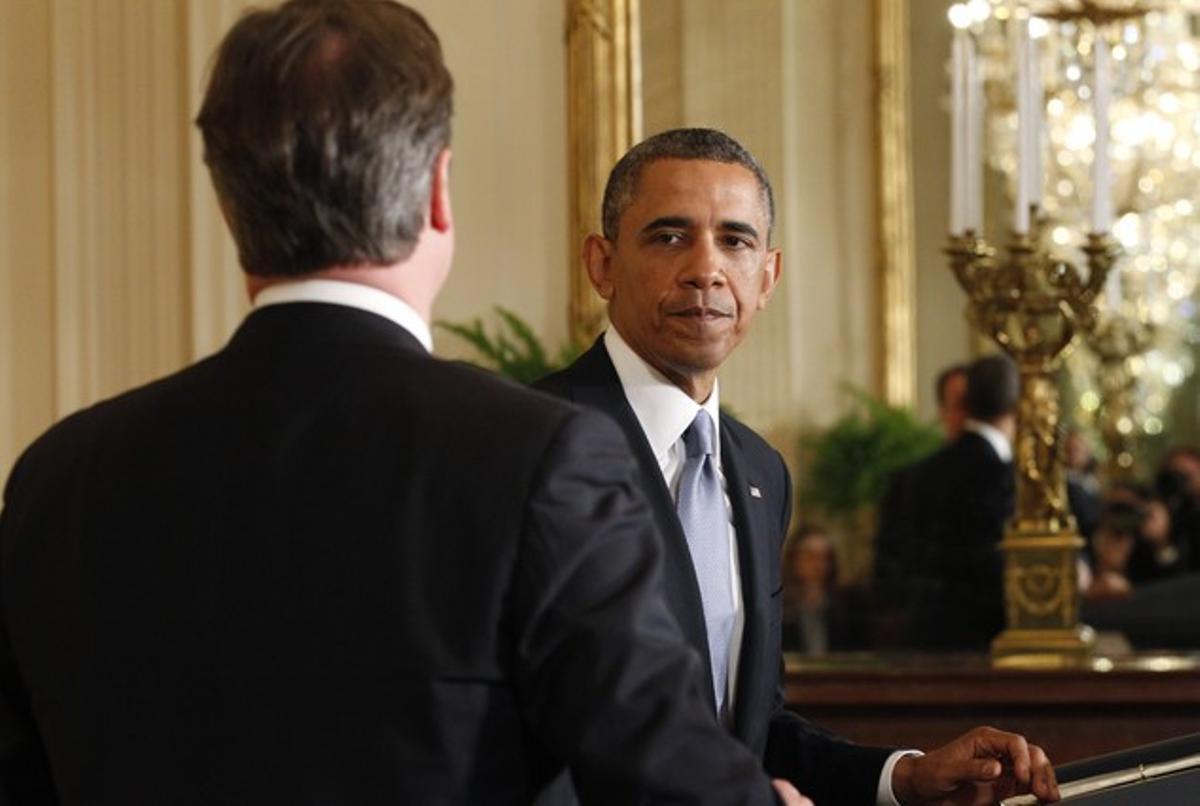 David Cameron (d’esquena) i Barack Obama, el maig passat a la Casa Blanca.
