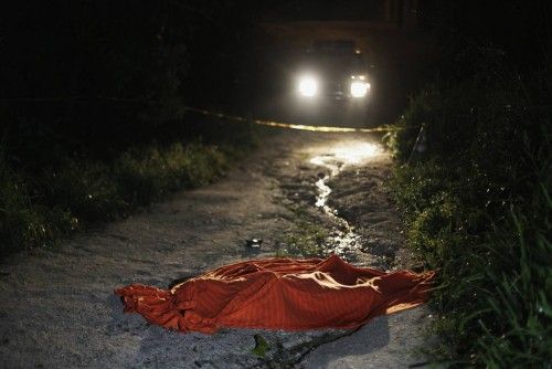 Un cadáver recubierto en San Pedro Sula (Honduras), la ciudad mas violenta del mundo