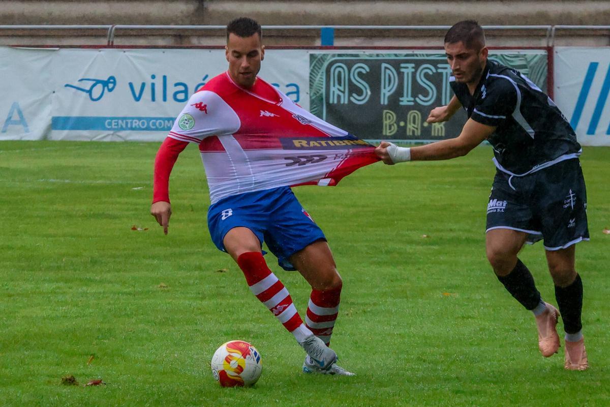 Concheiro agarrado por Piñeiro.