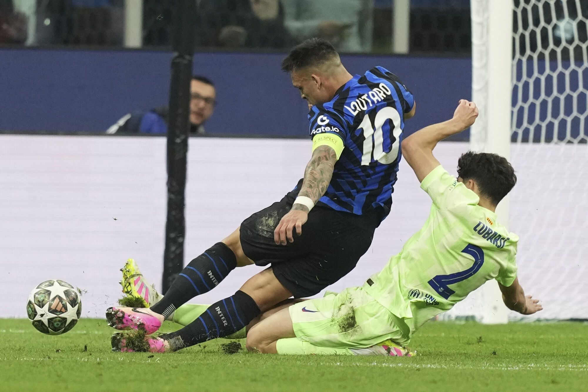 Barcelona's Pau Cubarsi fouls Inter Milan's Lautaro Martinez inside the penalty box during the Champions League semifinal second leg soccer match between Inter Milan and Barcelona at San Siro stadium in Milan , Italy, Tuesday, May 6, 2025. (AP Photo/Antonio Calanni)
