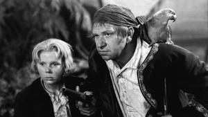 Fotograma de la película La isla del tesoro (1934), de Victor Fleming, con Jackie Cooper y Wallace Beery en los roles de Jim Hawkins y Long John Silver.