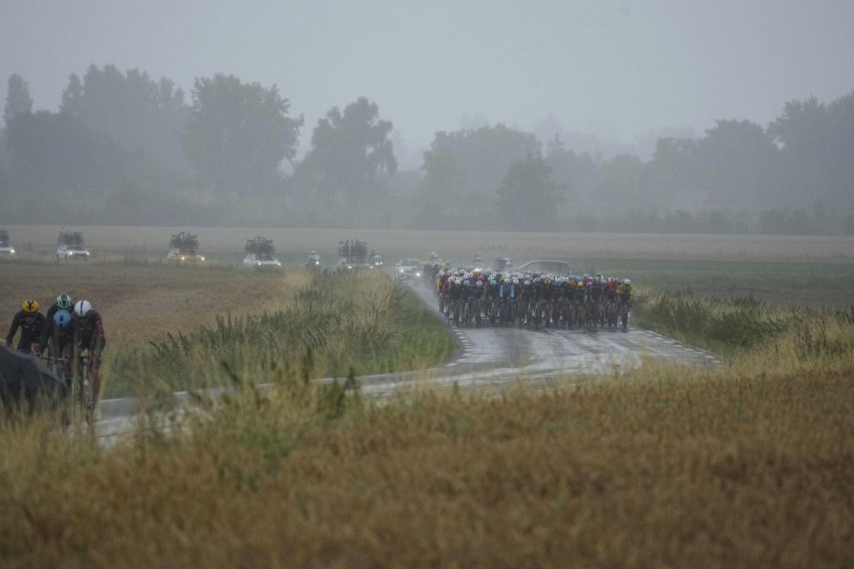 The pack and breakaway ride during the second stage of the Tour de France cycling race over 209.1 kilometers (129.9 miles) with start in Lauwin-Planque and finish in Boulogne-sur-Mer, France, Sunday, July 6, 2025. (AP Photo/Thibault Camus). EDITORIAL USE ONLY/ONLY ITALY AND SPAIN