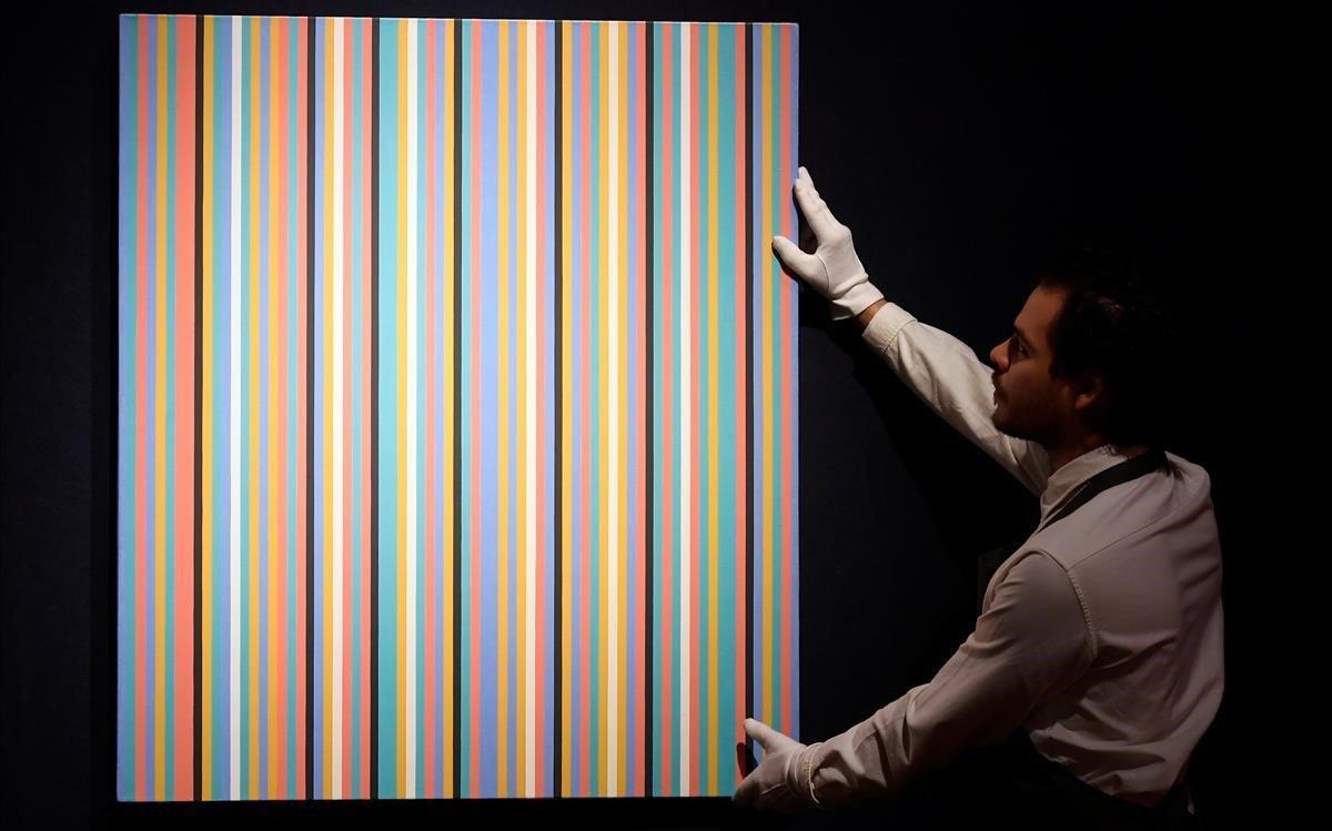 lmmarco47275748 an employee poses with  songbird  by bridget riley ahead of 190314173945