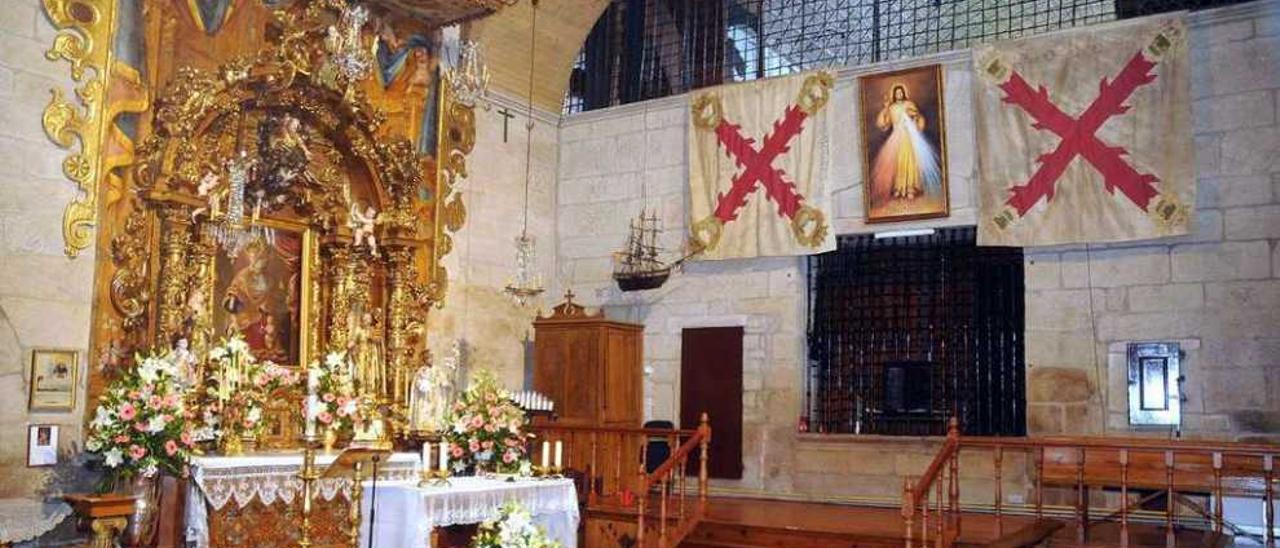 Interior de la iglesia, al fondo las banderas ofrendadas por los Héroes de Pontesampaio.// Gustavo Santos