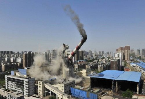The provincial highest chimney collapses as it is demolished by explosives in Shenyang, Liaoning province