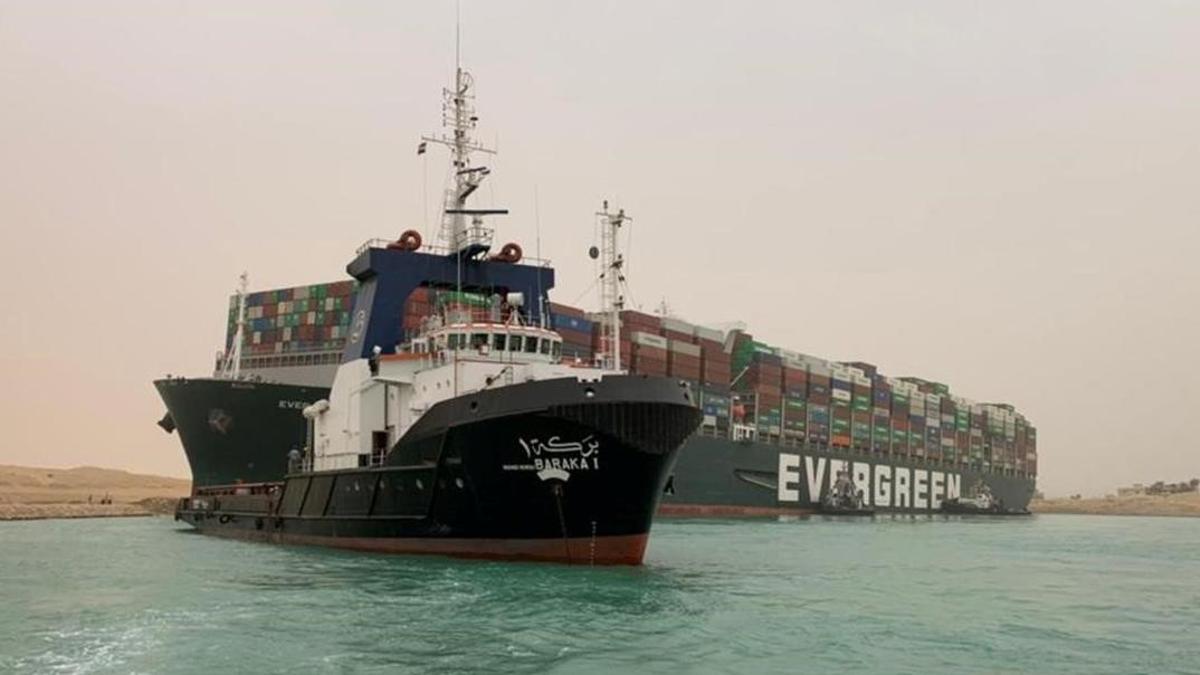 A container ship which was hit by strong wind and ran aground is pictured in Suez Canal  Egypt March 24  2021  SUEZ CANAL AUTHORITY Handout via REUTERS ATTENTION EDITORS - THIS IMAGE WAS PROVIDED BY A THIRD PARTY  NO RESALES  NO ARCHIVES