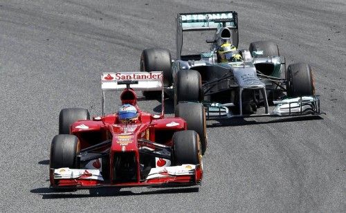 Ferrari Formula One driver Alonso drives ahead of Mercedes Formula One driver Rosberg during the Spanish F1 Grand Prix in Montmelo