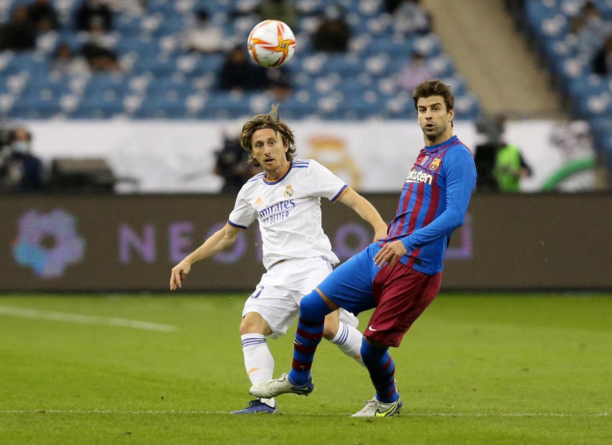 Luka Modric y Gerard Piqué.
