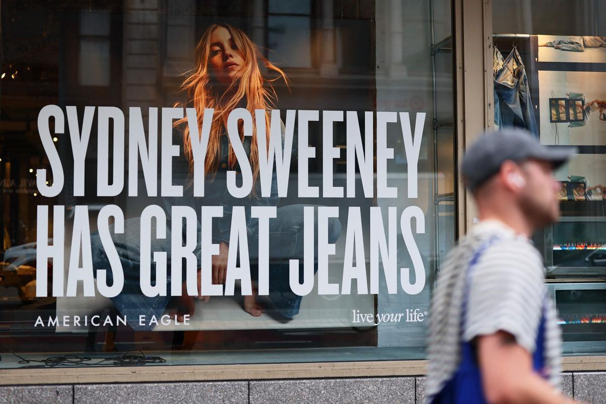 NEW YORK, NEW YORK - AUGUST 01: A window display of actress Sydney Sweeney is seen on a window of an American Eagle store on August 01, 2025 in New York City. American Eagle’s recent denim ad campaign featuring Sweeney has drawn backlash for language and imagery that critics say echoes eugenics-era rhetoric, following a tagline referencing “great genes” alongside visuals of Sweeney in blue jeans. Michael M. Santiago/Getty Images/AFP (Photo by Michael M. Santiago / GETTY IMAGES NORTH AMERICA / Getty Images via AFP)