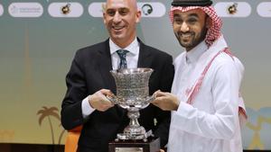 FILE - President of the Spanish Federation, Luis Rubiales, left, and Saudi General Sport Authority GSA chairman Prince Abdulaziz bin Turki Al-Faisal carry the Spanish super cup during a press conference in Jiddah Saudi Arabia, Wednesday, Dec. 18, 2019. Spanish police have arrested at least six people and raided the offices of the Spanish soccer federation as part of a corruption and money laundering investigation that includes suspicions regarding the federation’s deal with Saudi Arabia to take the Spanish Super Cup to the Middle Eastern country. Spain’s Guardia Civil said that they raided the federation’s offices near Madrid and a residence belonging to former federation president Luis Rubiales in the southern city of Granada. Police said that Rubiales was not among the six arrested. (AP Photo/Amr Nabil, File) / FILE PHOTO
