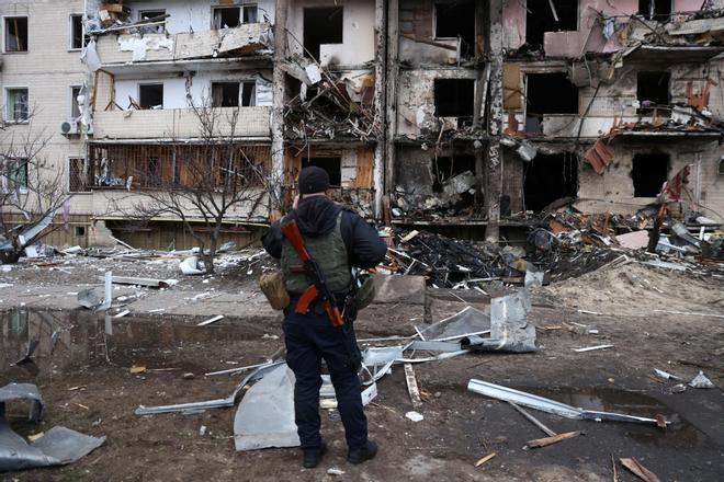 A residential building is damaged, after Russia launched a massive military operation against Ukraine, in Kyiv