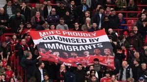 01 March 2026, United Kingdom, Manchester: Manchester United fans in the stands hold up a banner reading MUFC Proudly Colonised By Immigrants during the English Premier League soccer match between Manchester United and Crystal Palace at Old Trafford. Photo: Martin Rickett/PA Wire/dpa 01/03/2026 ONLY FOR USE IN SPAIN. Martin Rickett/PA Wire/dpa;soccer;football;sports;England Premier League - Manchester United vs Crystal Palace;