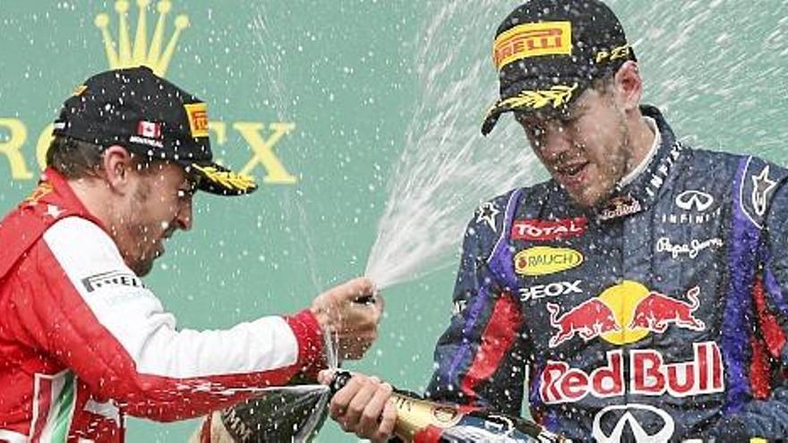 Fernando Alonso y Sebastian Vettel, en el podio de Montreal.