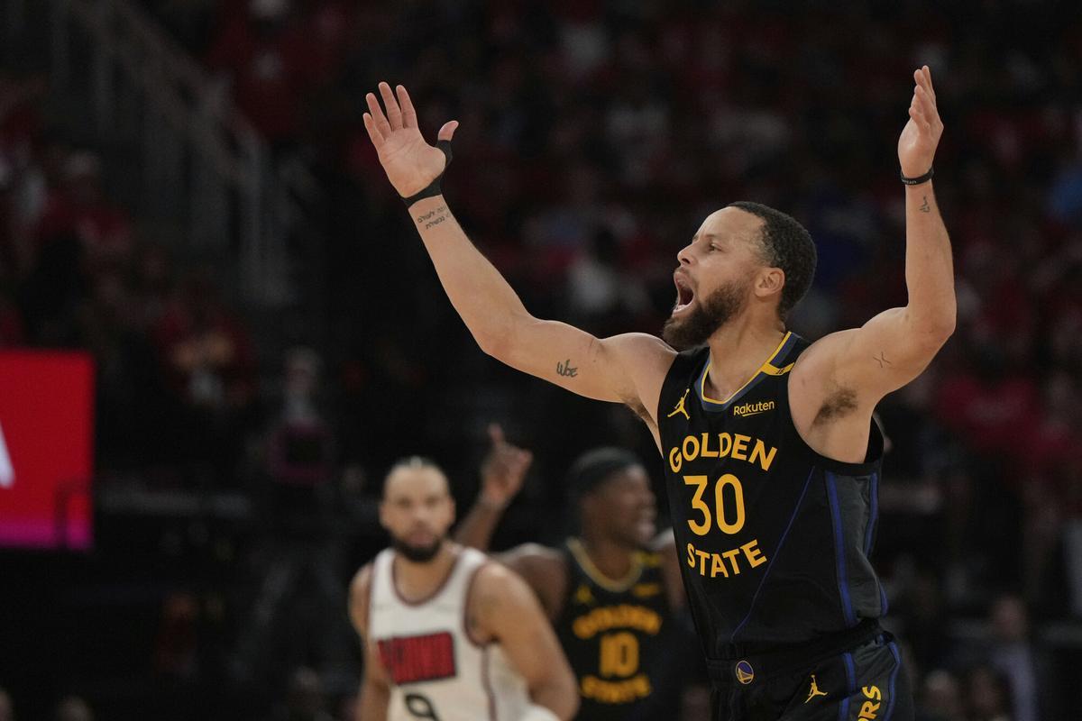 Golden State Warriors' Stephen Curry (30) celebrates after making a shot against the Houston Rockets during the first half of Game 7 of an NBA basketball first-round playoff series Sunday, May 4, 2025, in Houston. (AP Photo/Ashley Landis)