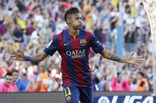 Barcelona's Neymar celebrates his goal against Real Sociedad during their Spanish first division soccer matchat Nou Camp stadium in Barcelona