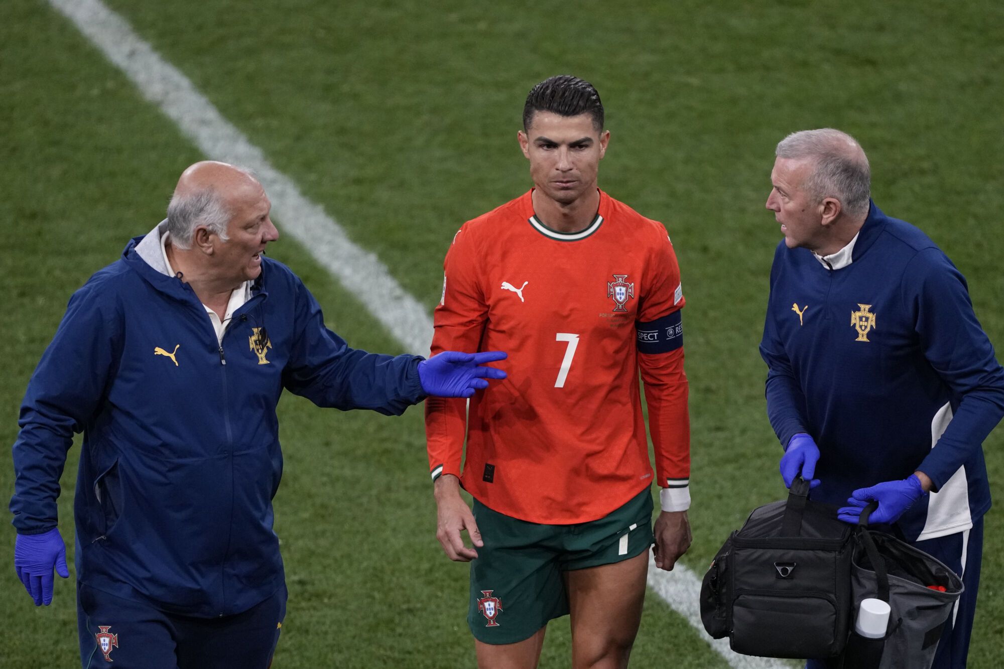Portugal's Cristiano Ronaldo, center, leaves the pitch during the Nations League final soccer match between Portugal and Spain at the Allianz Arena in Munich, Germany, Sunday, June 8, 2025. (AP Photo/Michael Probst). EDITORIAL USE ONLY/ONLY ITALY AND SPAIN