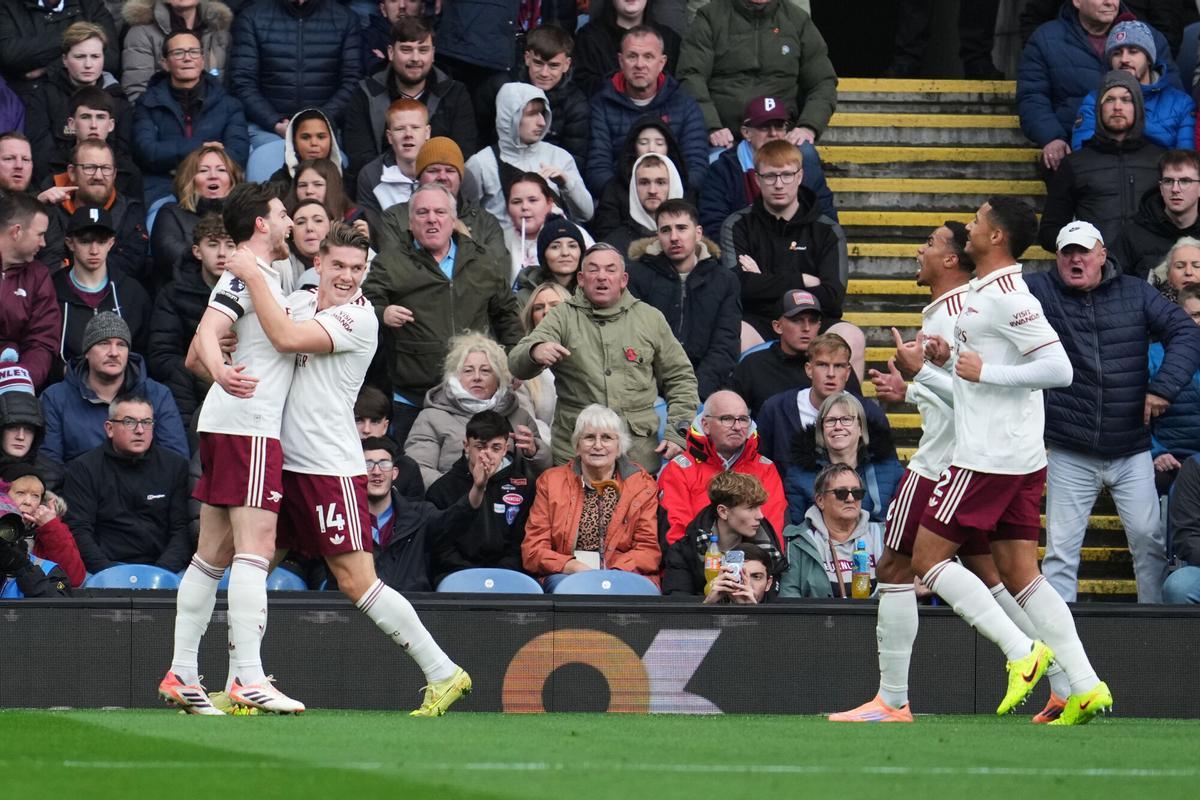 Arsenal's Viktor Gyoekeres, second left, , celebrates with Arsenal's Declan Rice after scoring his side's opening goal during the English Premier League soccer match between Burnley and Arsenal in Burnley, England, Saturday, Nov. 1, 2025. (AP Photo/Jon Super)