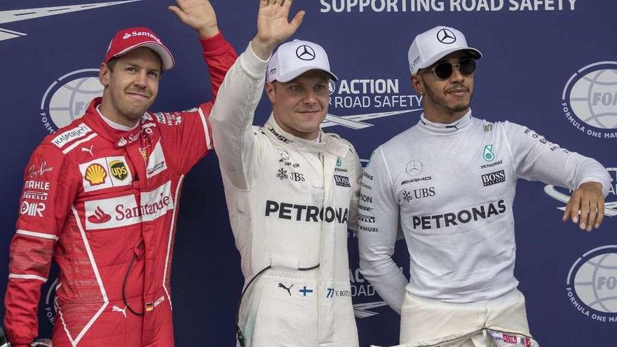 Vettel, Bottas y Hamilton, tras la calificación en Austria. // Efe