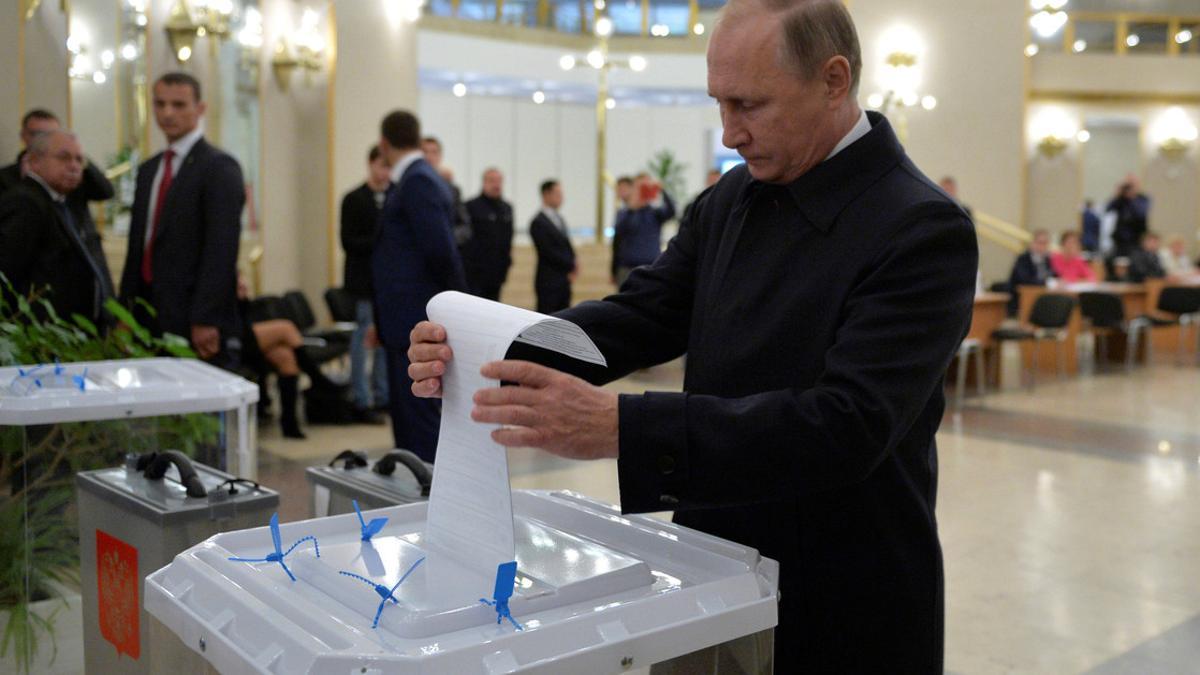 Russian President Putin casts ballot at polling station during parliamentary election in Moscow