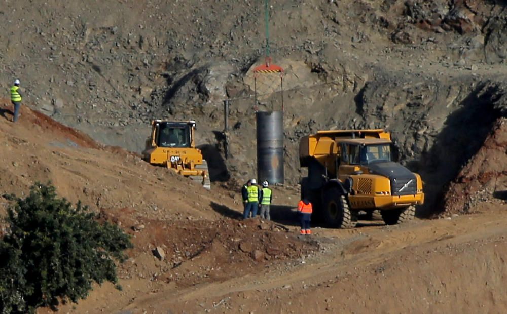 A steel tube is seen inside a drilled well at ...