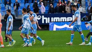 Los jugadores del Málaga, en un partido de la temporada.