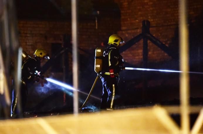 Firefighters tackle a fire at Camden Market in ...