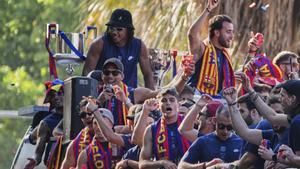 FC Barcelona players celebrate on the top of a bus their victory in the Spanish league title in Barcelona, Spain, Friday, May 16, 2025. (AP Photo/Emilio Morenatti)