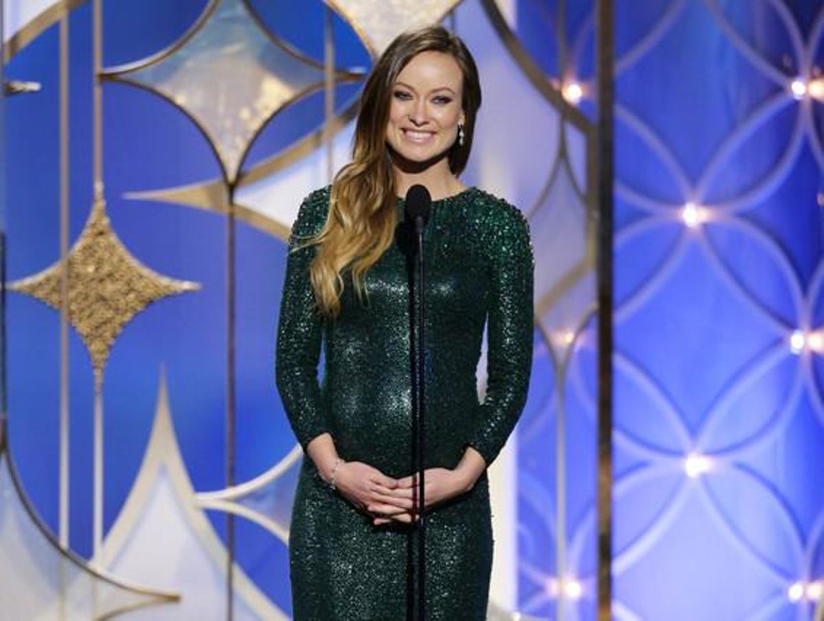 Olivia Wilde, embarassada, amb un ajustat vestit verd de Gucci.