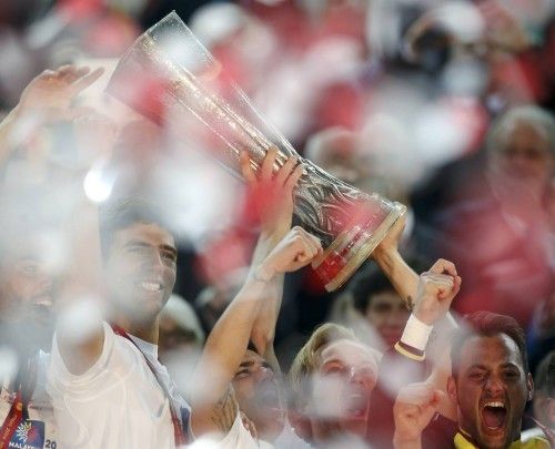 Sevilla's players celebrate with trophy after their Europa League final soccer match against Benfica at the Juventus stadium in Turin