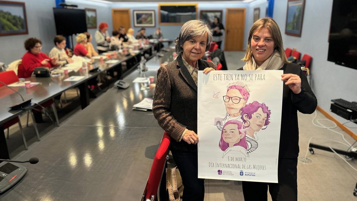 La directora del Insituto de la Mujer, María Jesús Álvarez, y Jimena Llameno, vicepresidenta del Gobierno de Asturias, con el cartel oficial del 8M