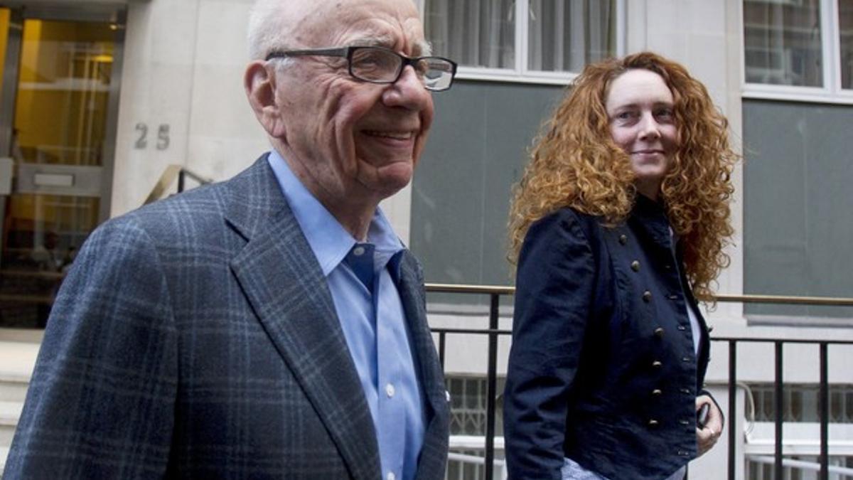 File photograph shows News Corporation CEO Rupert Murdoch leaving his flat with Rebekah Brooks, chief executive of News International,  in central London