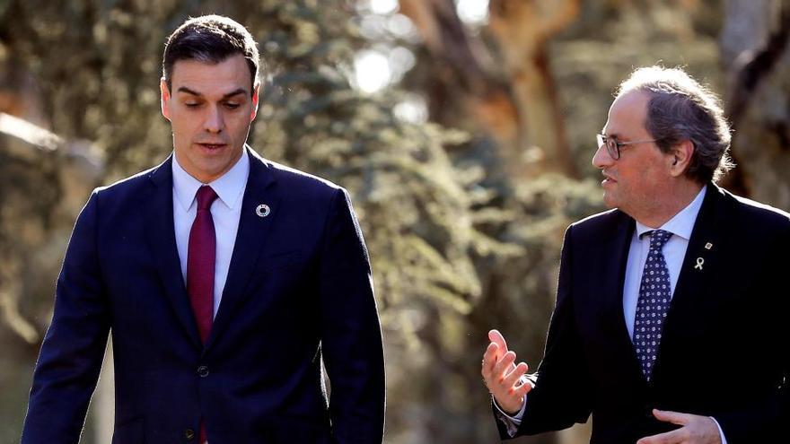 Pedro Sánchez y Quim Torra durante la mesa de diálogo en febrero.