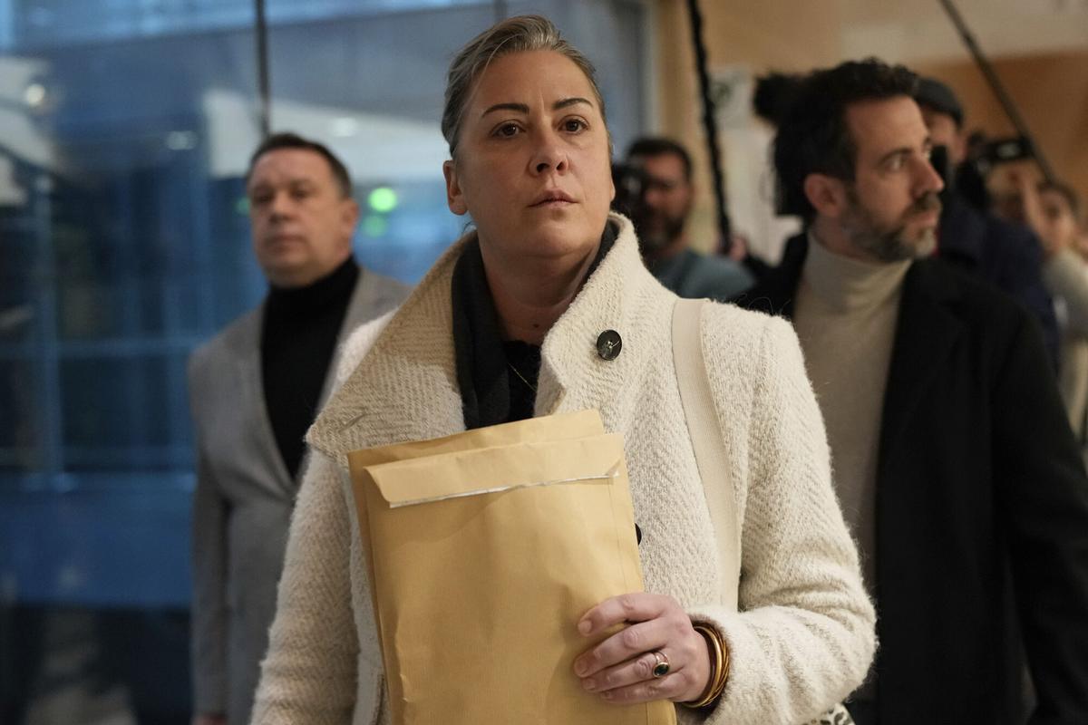 The daughter of Gisele Pelicot, Caroline Darian, arrives in the Avignon courthouse, southern France, Thursday, Dec. 19, 2024. (AP Photo/Lewis Joly)
