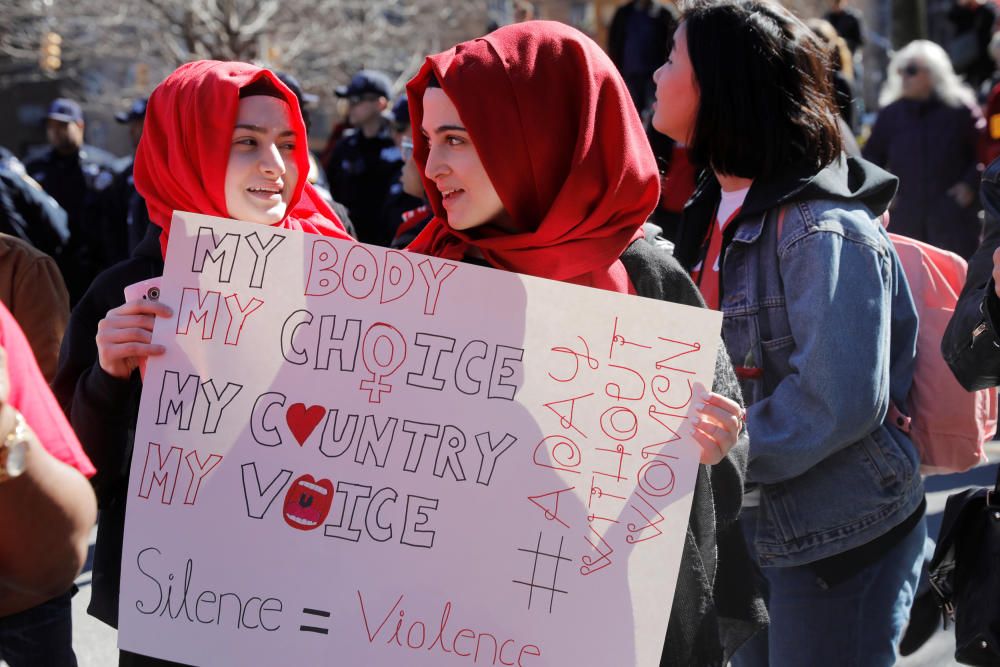 Women take part in a 'Day Without a Woman' march ...