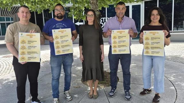 Blanco y representantes de las bandas participantes.