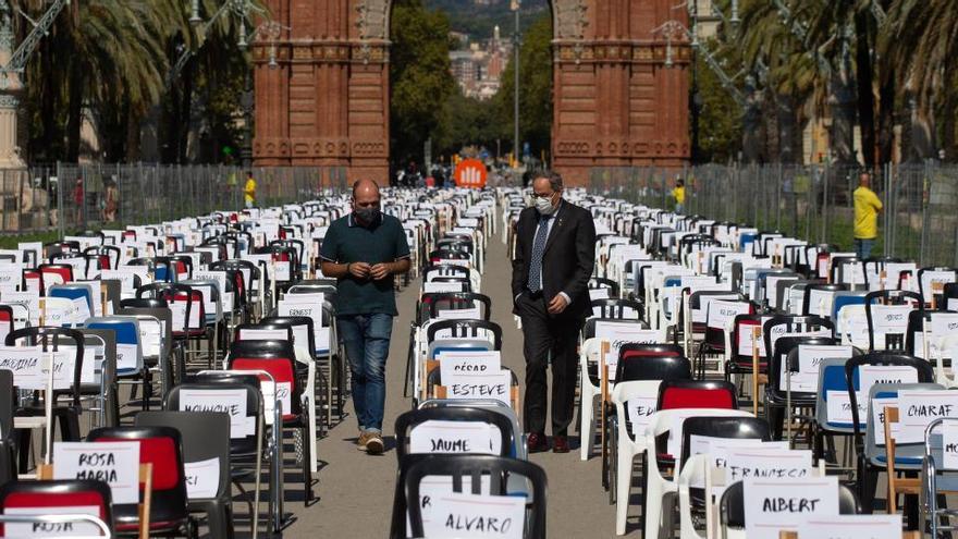 Marcel Mauri i Quim Torra, entre les 2850 cadires buides