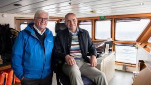 13/06/2019 13 June 2019, Iceland, Reykjavik: German President Frank-Walter Steinmeier (L) and Gudni Thorlacius Johannesson President of Iceland, take a ferry to Heimaey Island on the Westman Islands. Steinmeier and his wife are on a two-day state visit to Iceland. Photo: Bernd von Jutrczenka/dpa