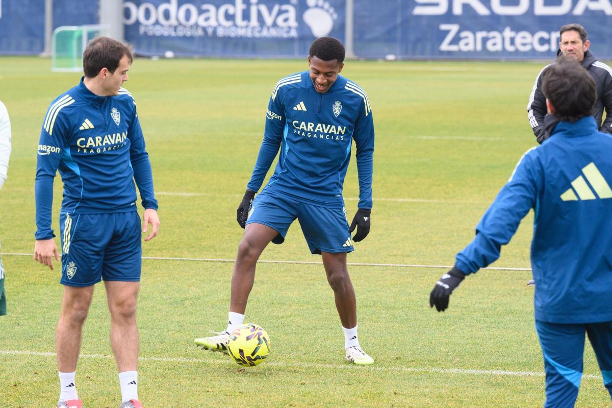 Álex Gomes, en un entrenamiento junto a Francho Serrano.
