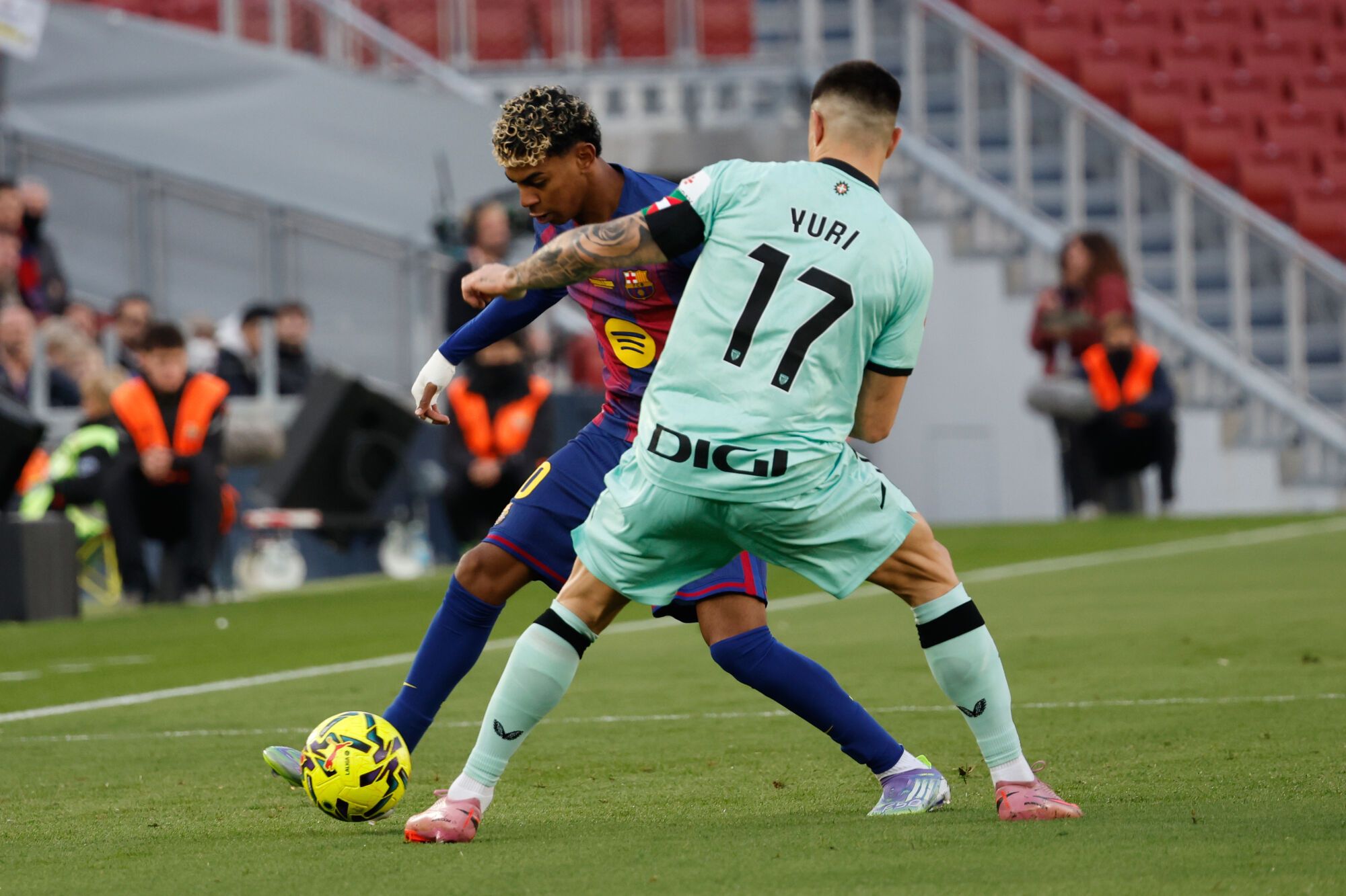 Barcelona's Lamine Yamal, left, and Athletic Bilbao's Yuri Berchiche fight for the ball during a La Liga soccer match between Barcelona and Athletic in Barcelona, Spain, Saturday, Nov. 22, 2025. AP Photo/Joan Monfort)