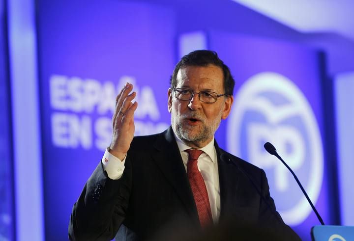 Spanish Prime Minister and People's Party (PP) leader Mariano Rajoy delivers a speech during a campaign rally ahead of Spain's general election in Valencia