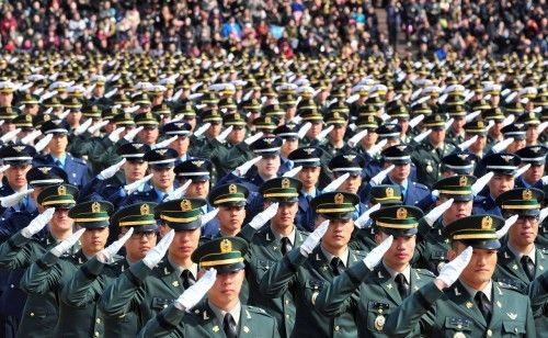 New South Korean military officers salute during a joint commissioning ceremony for 5,860 new officers from the Army, Navy, Air Force and Marines at the military headquarters in Gyeryong