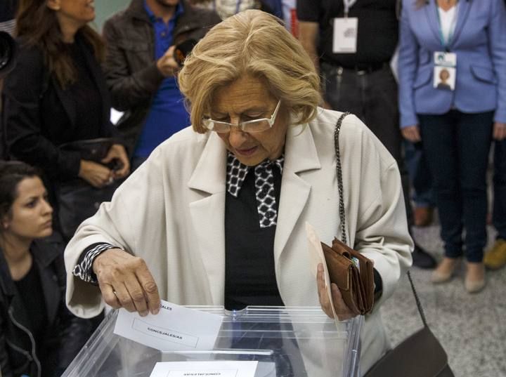 Carmena, local candidate of Ahora Madrid (Now Madrid), casts her vote at a polling station during regional and municipal elections in Madrid