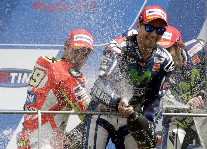 Yamaha MotoGP rider Lorenzo of Spain celebrates his victory on the podium after the Italian Grand Prix at the Mugello circuit