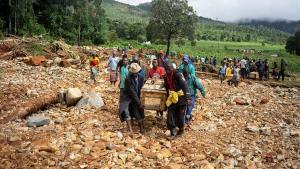 zentauroepp47411005 men carry a coffin on along a makeshift path on the river in190318193720